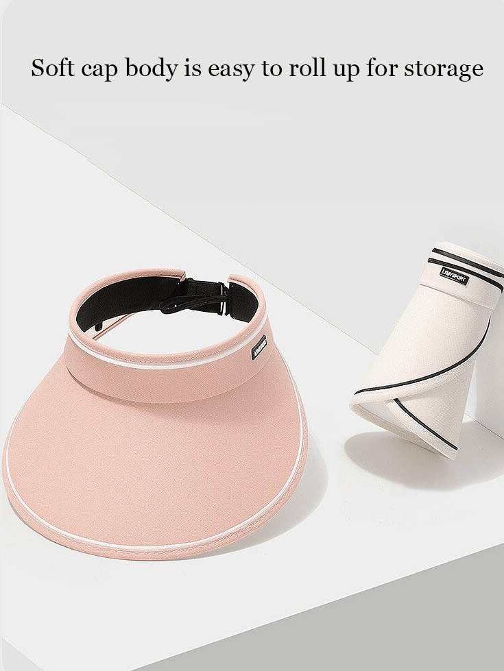 Women's foldable sun-proof visor hat with adjustable fit, shown in pink, highlighting easy storage with roll-up design.